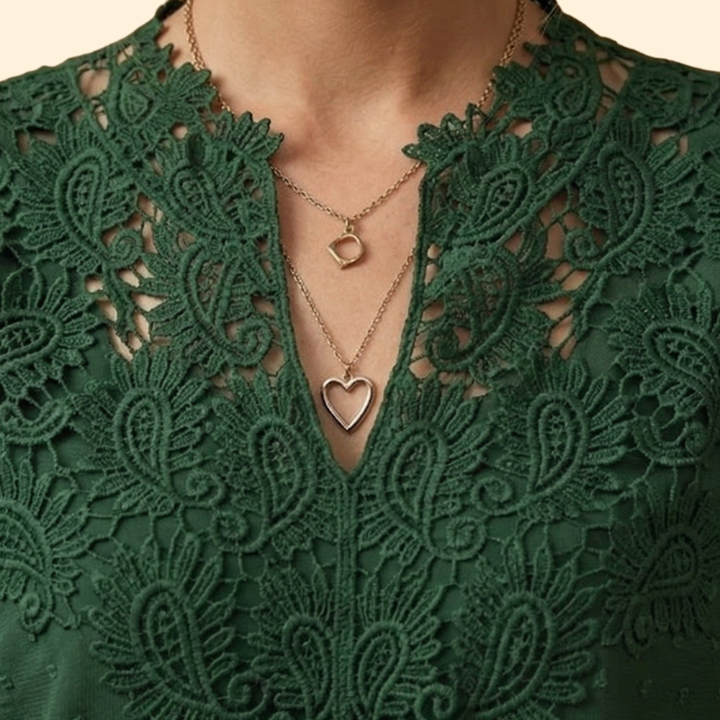 Sophisticated women's embroidered lace blouse, a chic and versatile addition to ladies' wear.
