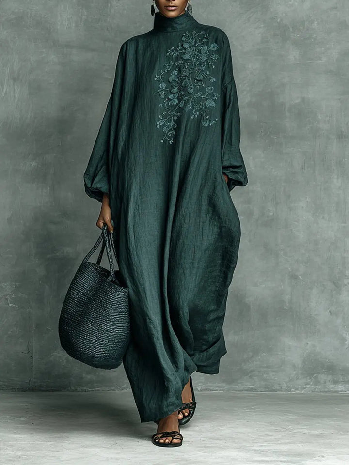Elegant women's embroidered maxi dress with high-neck & long sleeves. Relaxed fit, floral design for modest fashion.