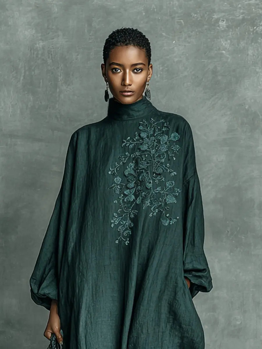 Women's high-neck long sleeve embroidered maxi dress. Relaxed fit with elegant floral details for versatile wear.