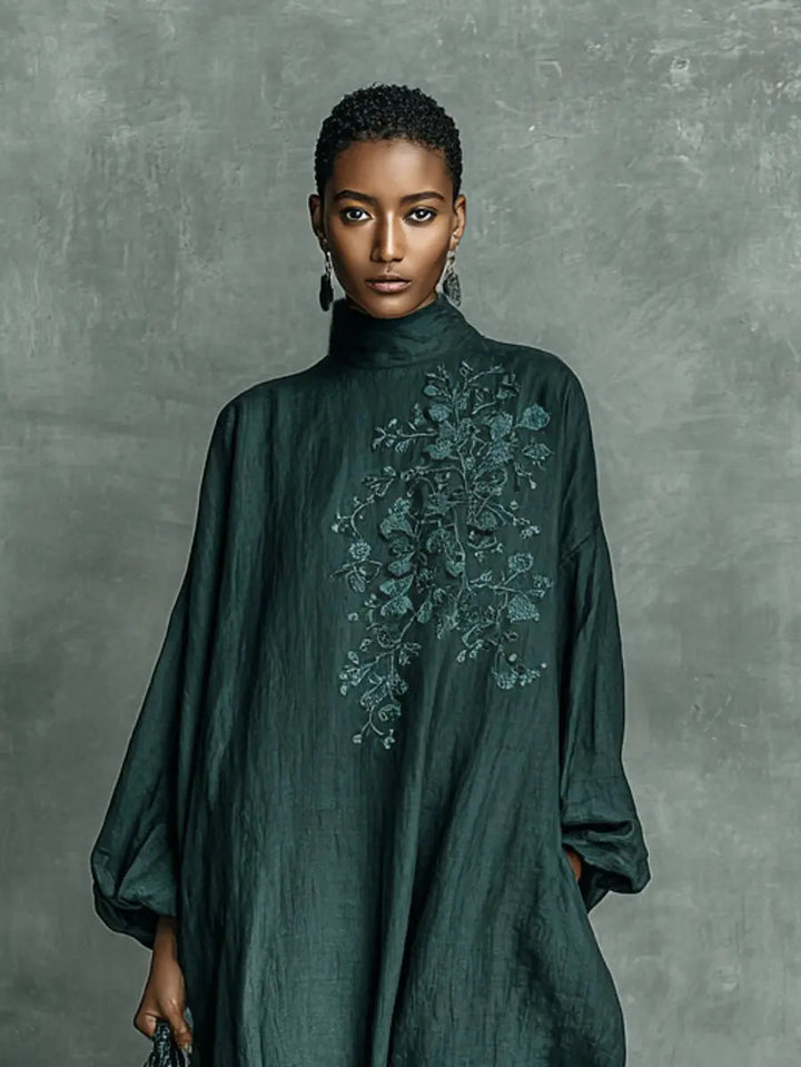Women's high-neck long sleeve embroidered maxi dress. Relaxed fit with elegant floral details for versatile wear.