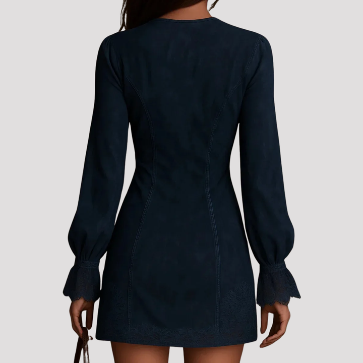 Detailed embroidery on an elegant women's mini dress with a stylish zip neck and long sleeves.