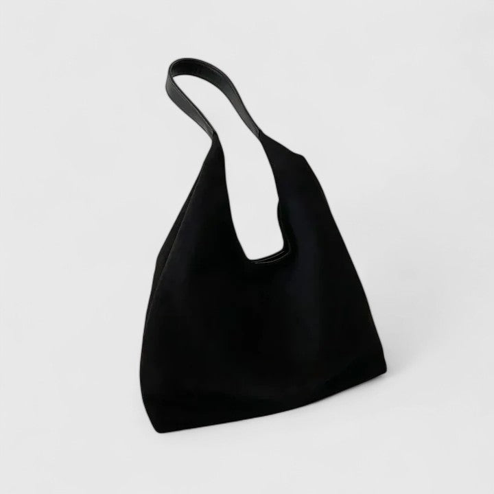 Elegant women's spacious everyday tote. Stylish fashion accessory shoulder bag for sophisticated appeal.