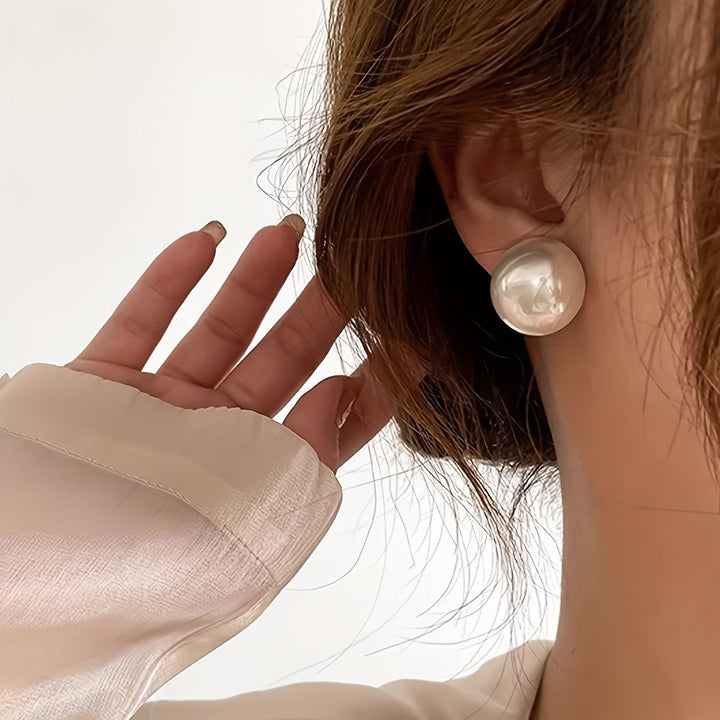 Elegant women's faux pearl stud earrings. Statement jewelry for classic style, hypoallergenic & timeless fashion.