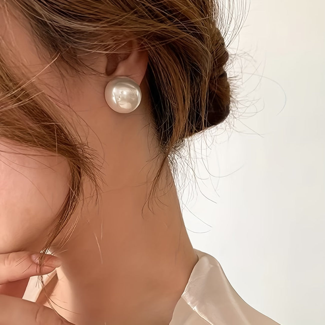 Hypoallergenic statement pearl stud earrings for women. Timeless faux pearl jewelry, perfect for elegant fashion.