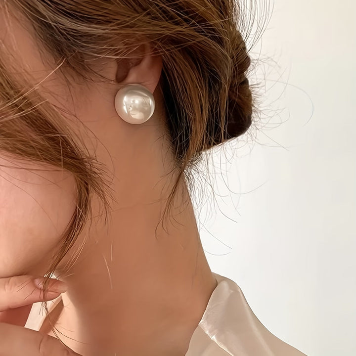 Hypoallergenic statement pearl stud earrings for women. Timeless faux pearl jewelry, perfect for elegant fashion.