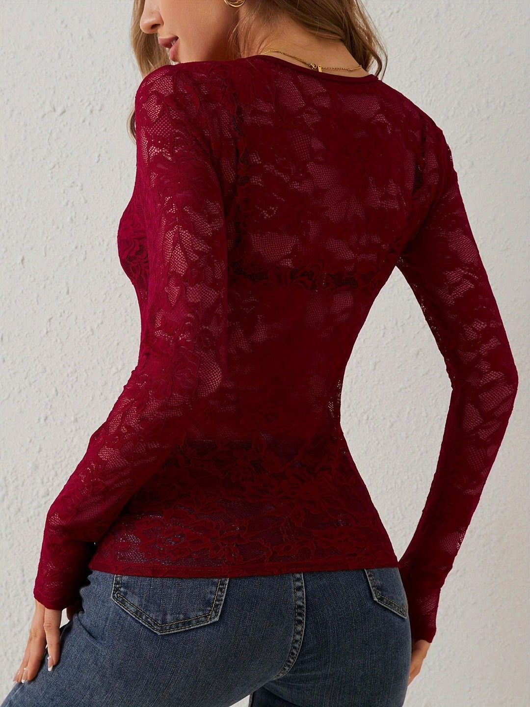 Stylish women's sheer lace long sleeve top with a flattering V-neck, ideal for party wear.