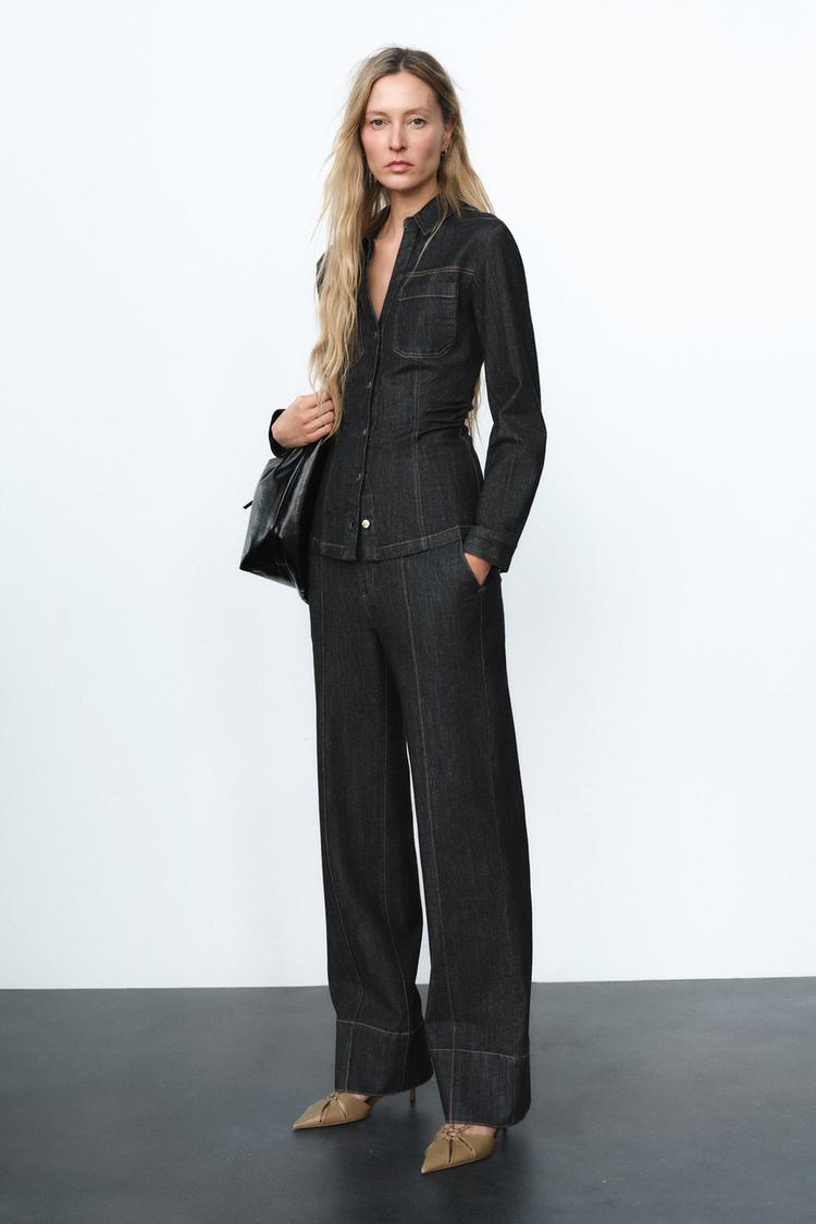 Chic women's two-piece outfit featuring a flattering fitted top & comfortable, stylish trousers for modern women.