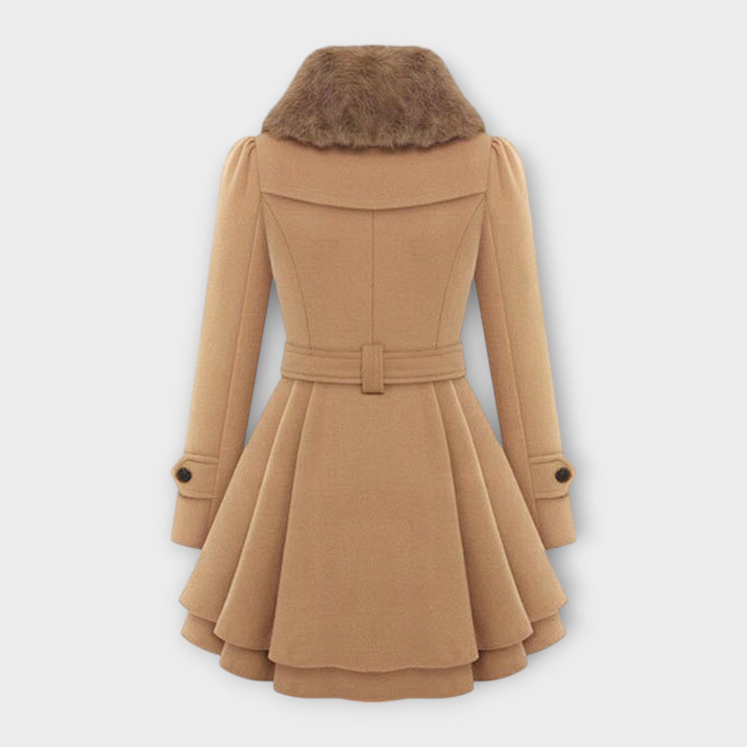 Stylish beige women's long flared coat featuring a luxurious faux fur collar. Ideal elegant winter outerwear.