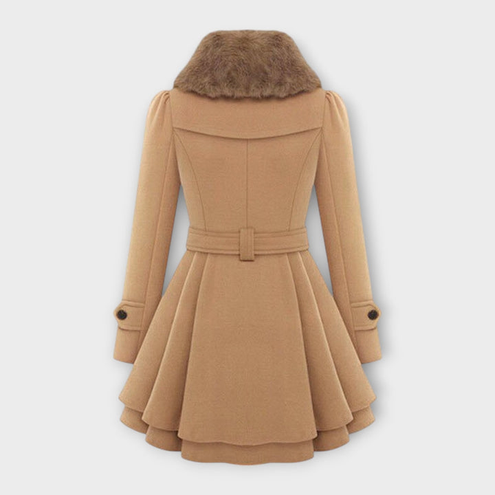 Stylish beige women's long flared coat featuring a luxurious faux fur collar. Ideal elegant winter outerwear.