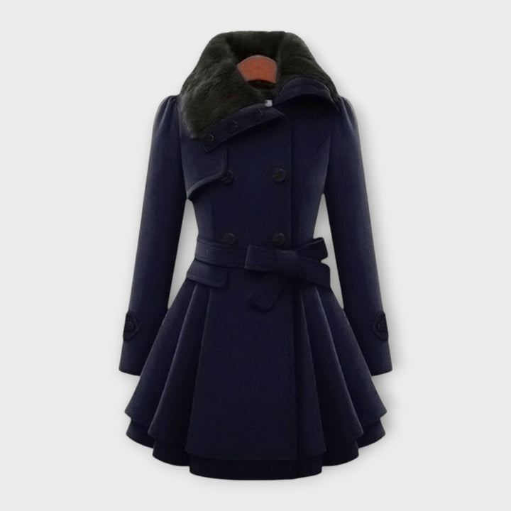 Dark blue women's elegant long flared coat with a luxurious faux fur collar. Essential winter outerwear.
