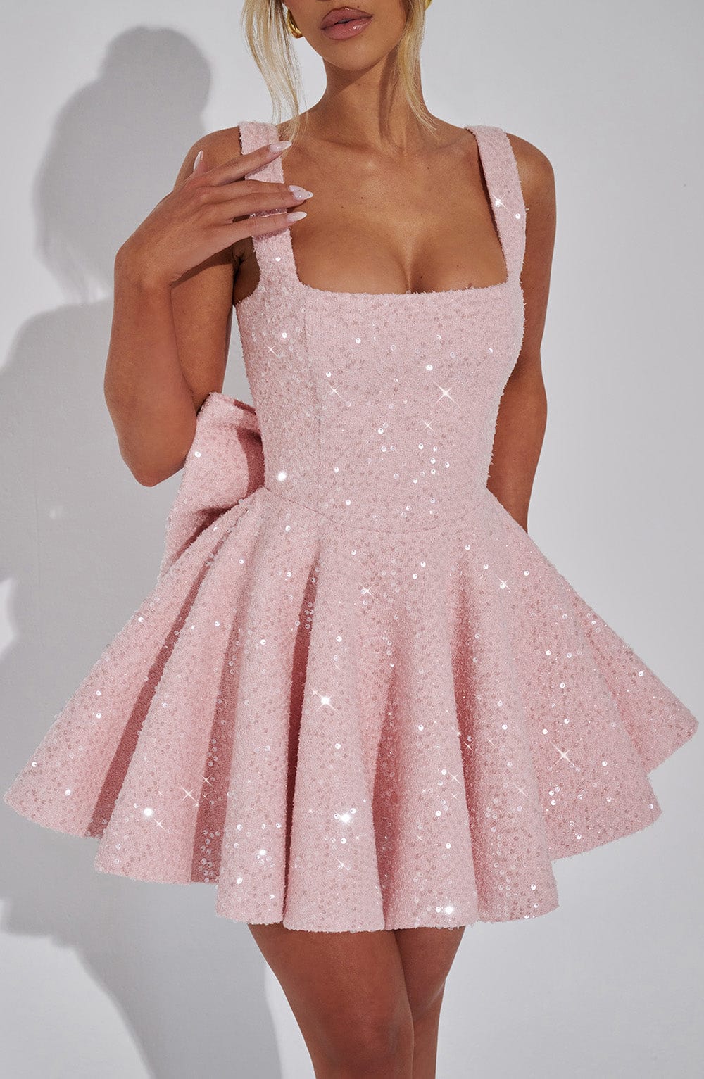 Elegant women's mini dress, flared design & bow accent, perfect for various special occasions.