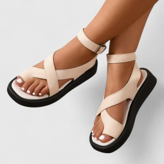 Chic flat sandals with adjustable straps, perfect for summer & spring.