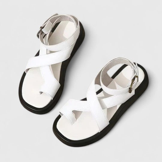 Comfortable women's flat sandals with secure adjustable straps for all-day wear.
