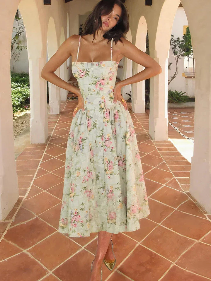 Elegant women's floral A-line midi dress, perfect for wedding guests. Strappy design, ideal for spring & summer occasions.