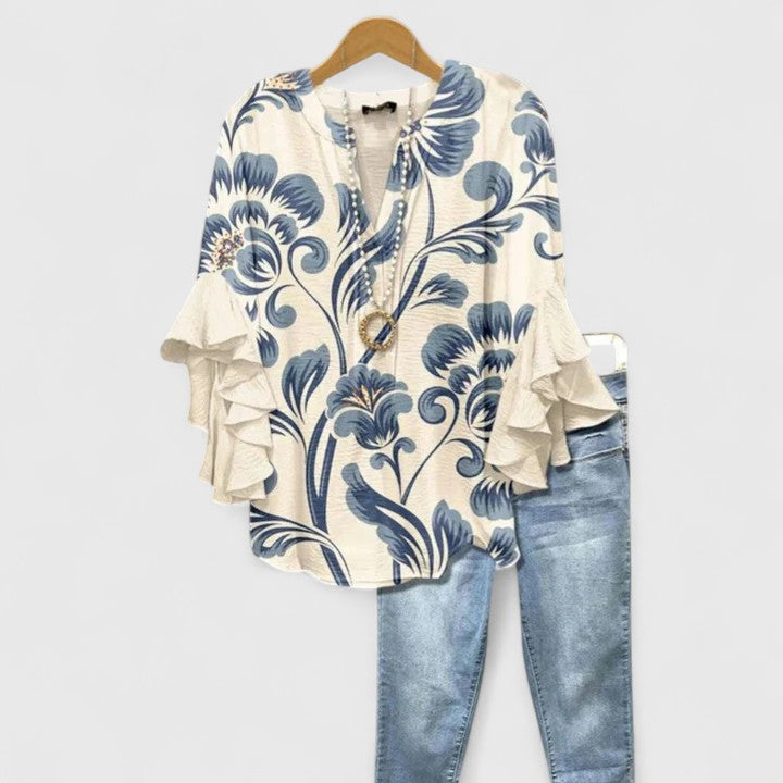 Elegant women's floral blouse with chic ruffles, perfect for spring fashion and versatile styling.