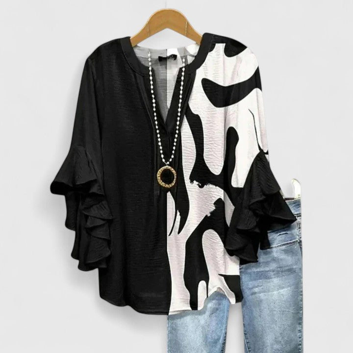 Vibrant floral women's top, a comfortable and chic choice for spring and summer fashion apparel.