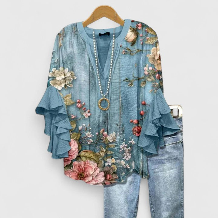 Versatile women's floral blouse with ruffle sleeves, perfect for comfortable & elegant everyday wear.