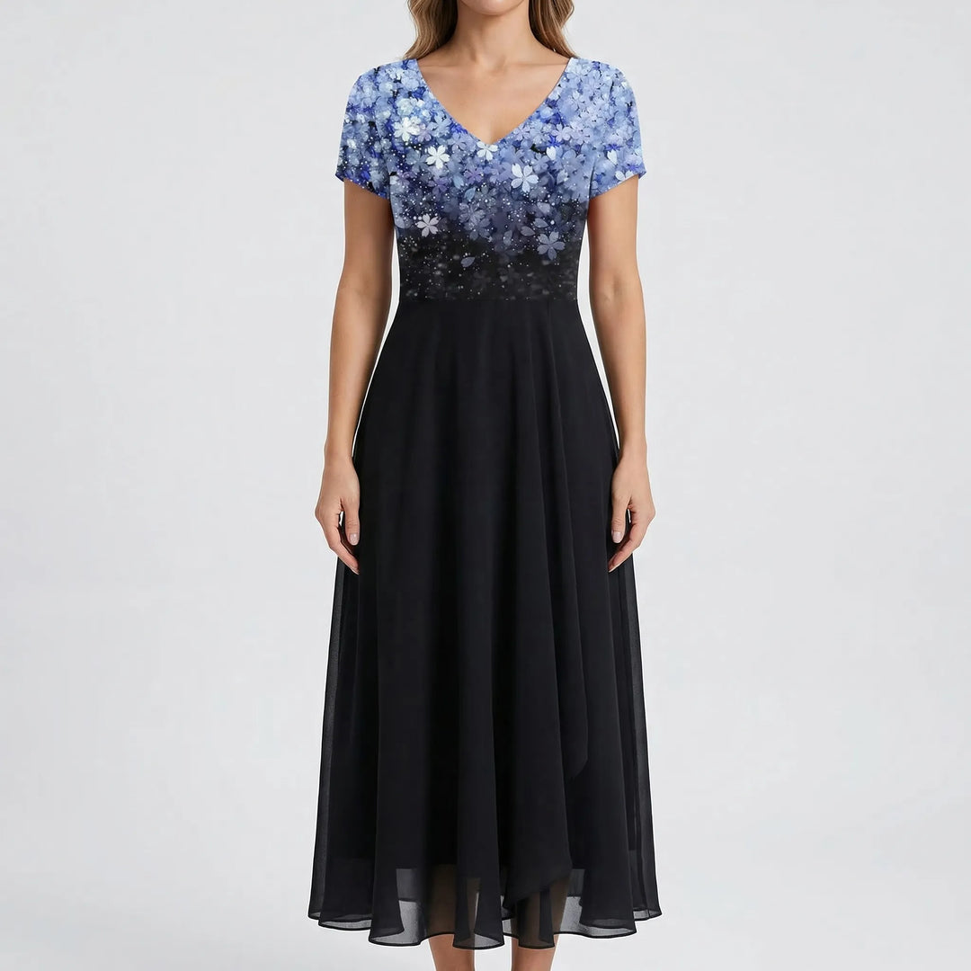 Beautiful V-neck floral bodice on a sophisticated women's midi dress with elegant short sleeves. Occasion wear.