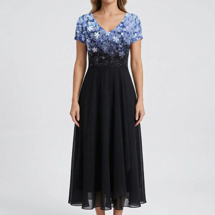 Beautiful V-neck floral bodice on a sophisticated women's midi dress with elegant short sleeves. Occasion wear.
