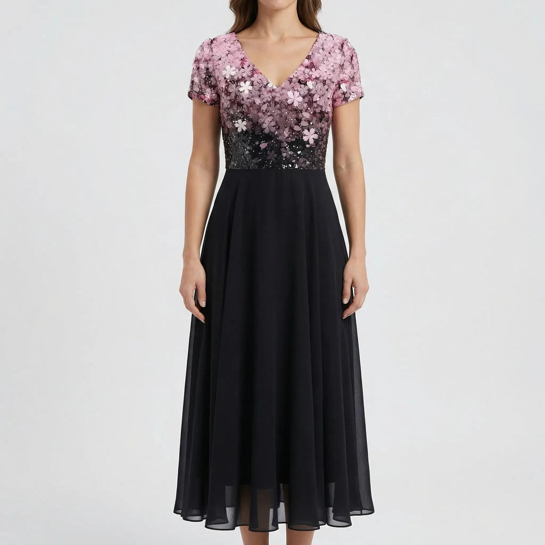 Flowy A-line women's floral midi dress, featuring a delicate V-neck bodice & cap sleeves. Versatile for formal events.