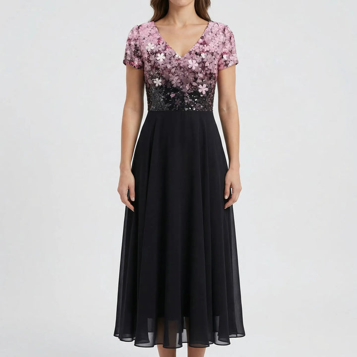 Flowy A-line women's floral midi dress, featuring a delicate V-neck bodice & cap sleeves. Versatile for formal events.