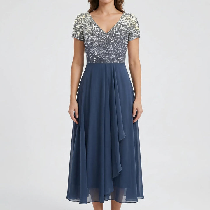Versatile women's elegant floral midi dress. A-line cut, V-neck, & cap sleeves suitable for various formal occasions.