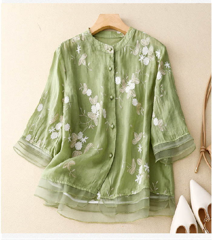 Elegant women's floral button-down blouse with 3/4 sleeves, perfect for spring and summer fashion.