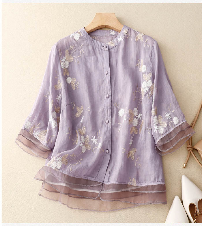 Lightweight summer women's floral blouse, a casual button-down top with practical 3/4 sleeves.