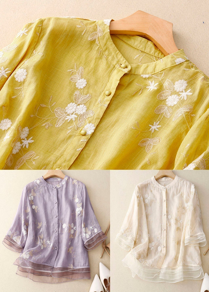 Comfortable women's floral blouse, a chic button-down top with 3/4 sleeves and a flattering layered hem.
