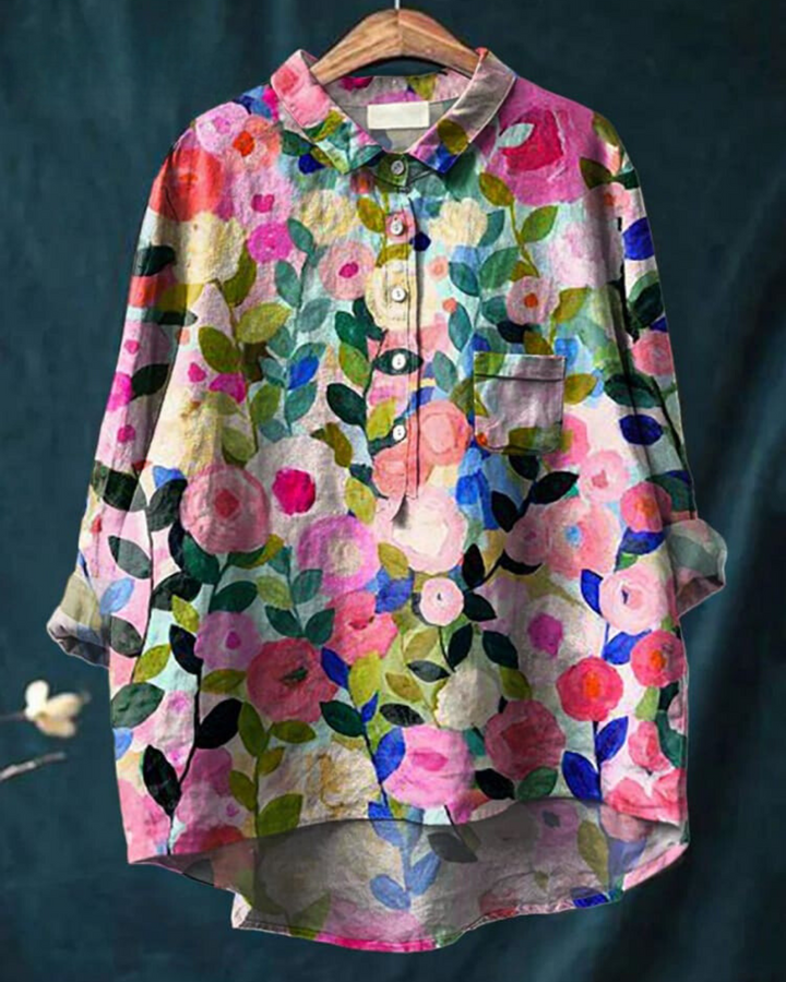 Elegant women's floral button-up blouse with long sleeves, perfect for spring fashion.