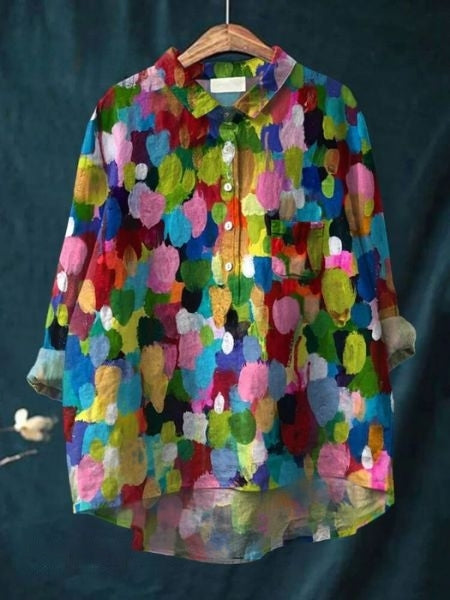 Feminine floral long-sleeve blouse for women, featuring elegant button-up details.