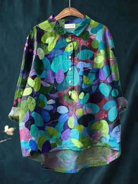 Workwear-ready women's floral button-up blouse, an elegant long-sleeve top.