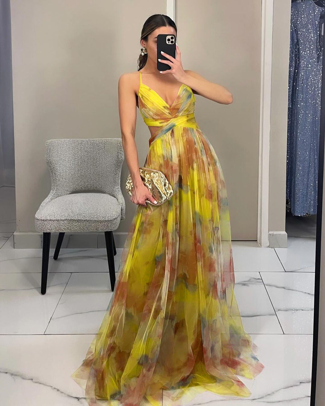 Chiffon evening gown with delicate floral pattern, ideal for parties.