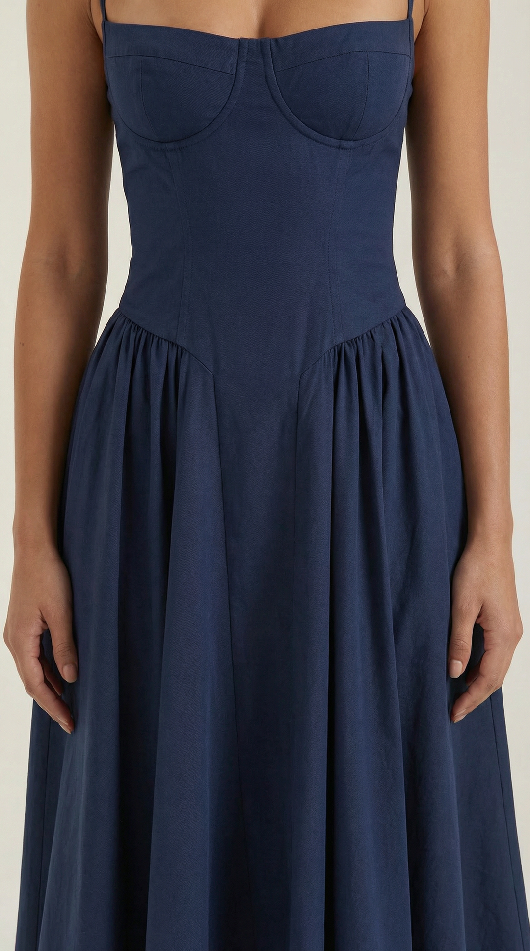 Detail of the corset and sweetheart neckline on a beautiful women's floral midi dress.