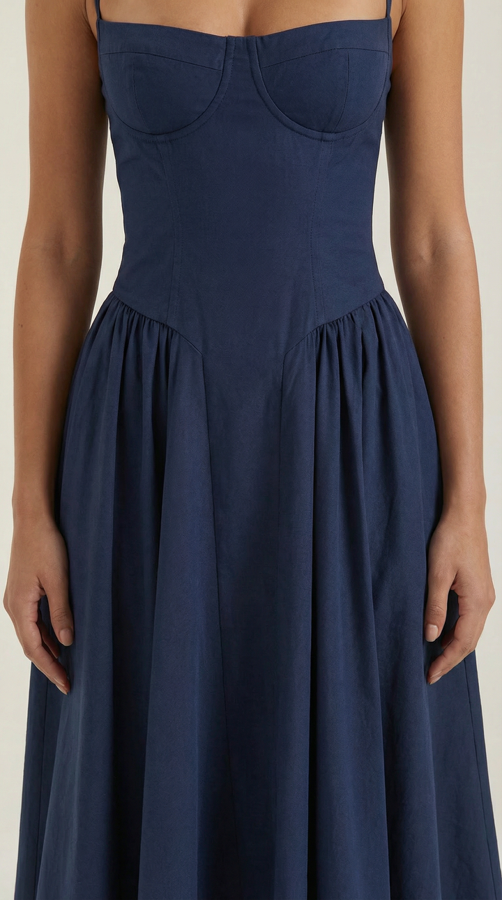 Detail of the corset and sweetheart neckline on a beautiful women's floral midi dress.