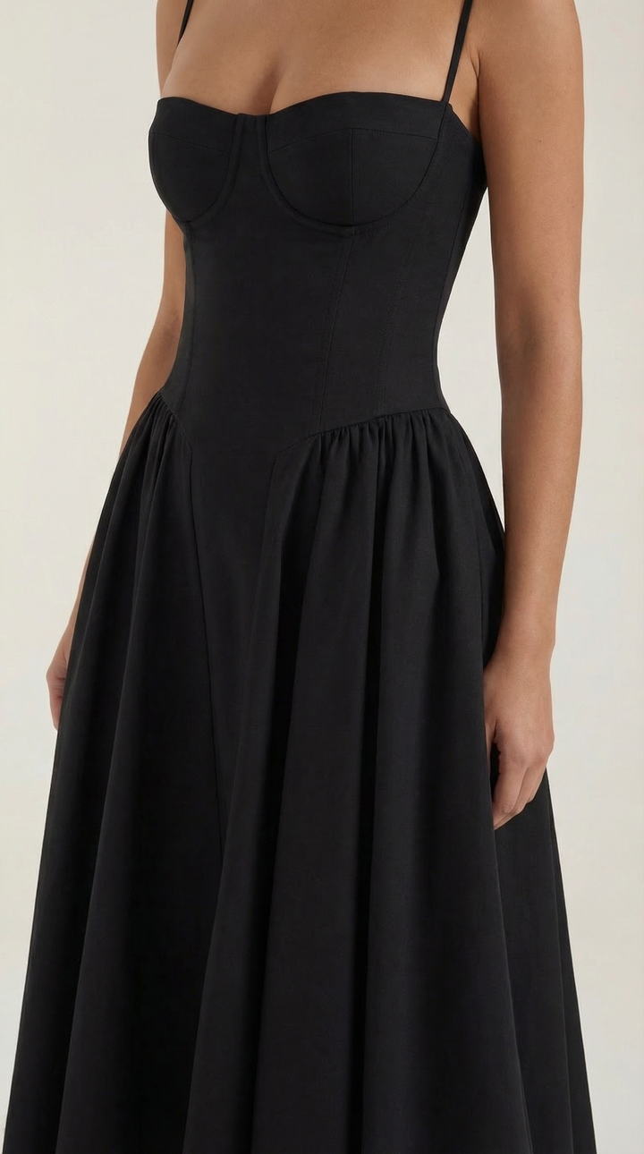 Close-up: Beautiful floral print on a women's midi dress, with a sweetheart neckline and corset.
