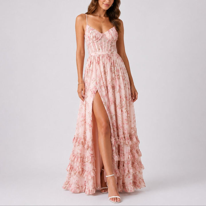 Women's elegant A-line maxi dress featuring floral print & corset detail, suitable for wedding guest attire.