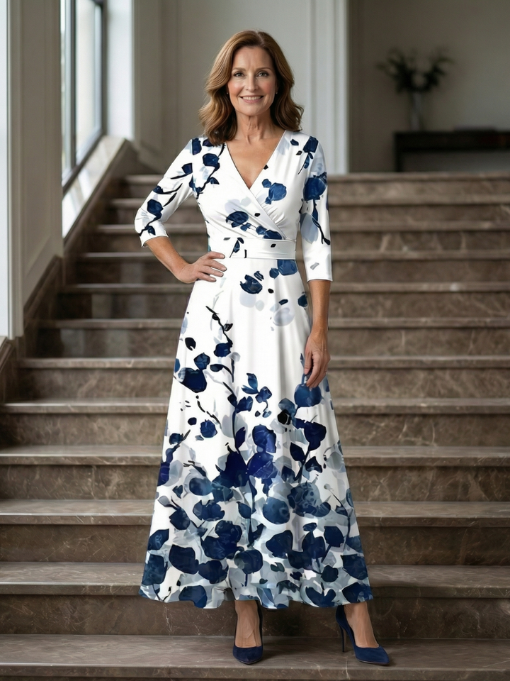 Spring women's floral midi dress, versatile cross wrap design & three-quarter sleeves for elegance.