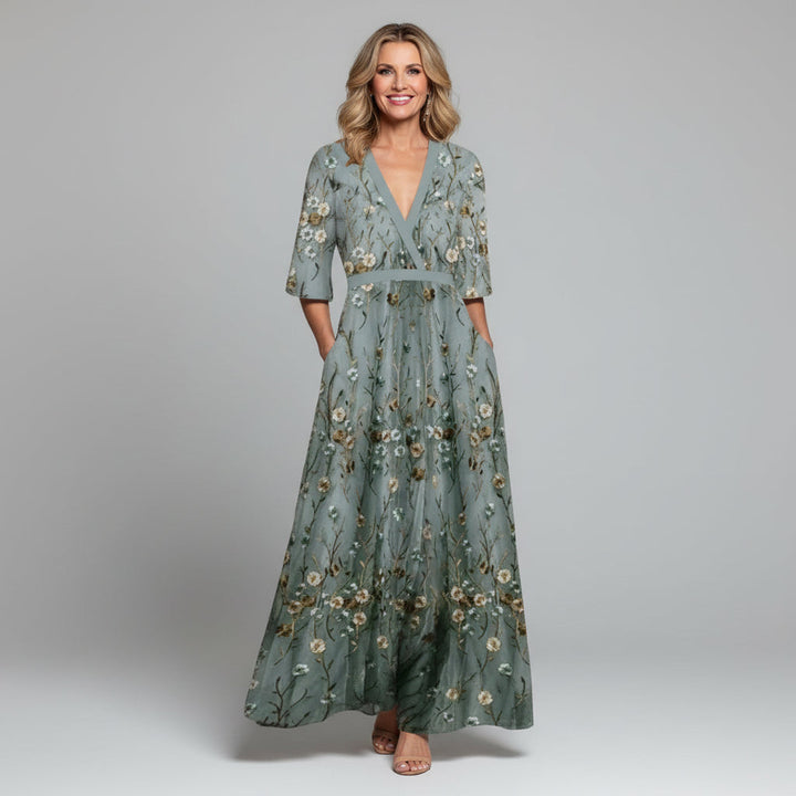 Beautiful boho-style maxi dress with intricate floral embroidery for wedding guests.