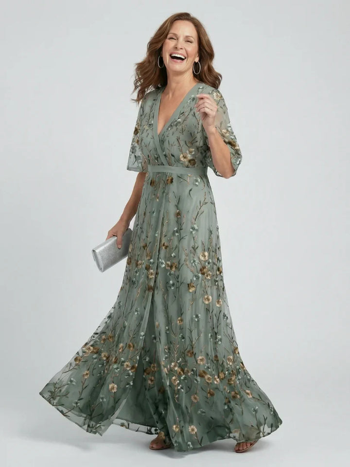 Flowy floral embroidered maxi dress designed for summer holidays and wedding celebrations.