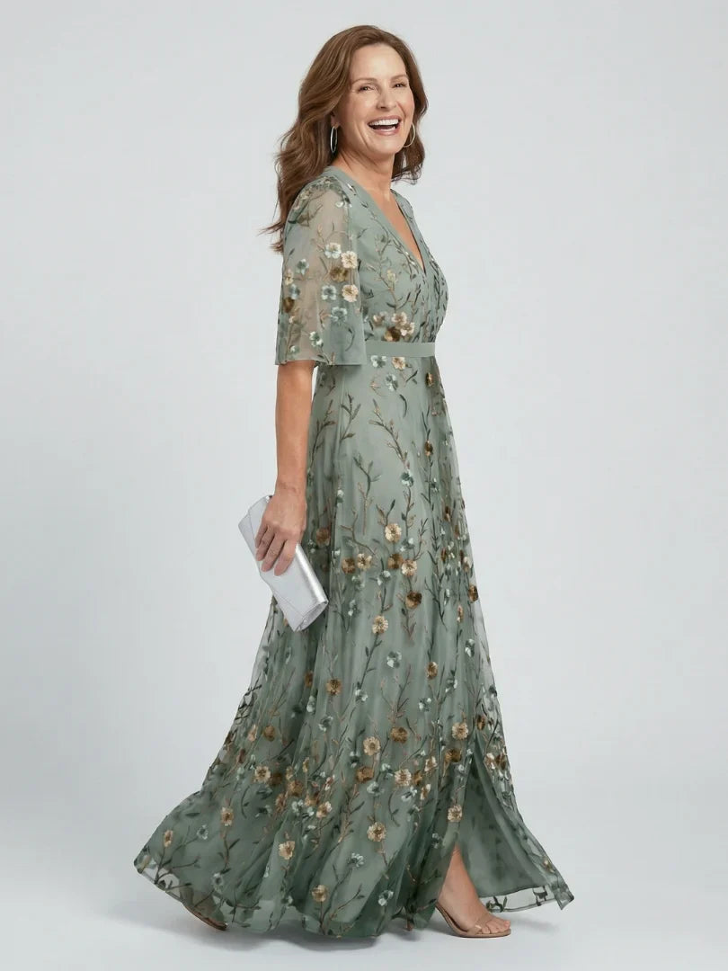 Women's stunning embroidered maxi dress with floral patterns, a perfect wedding guest option.