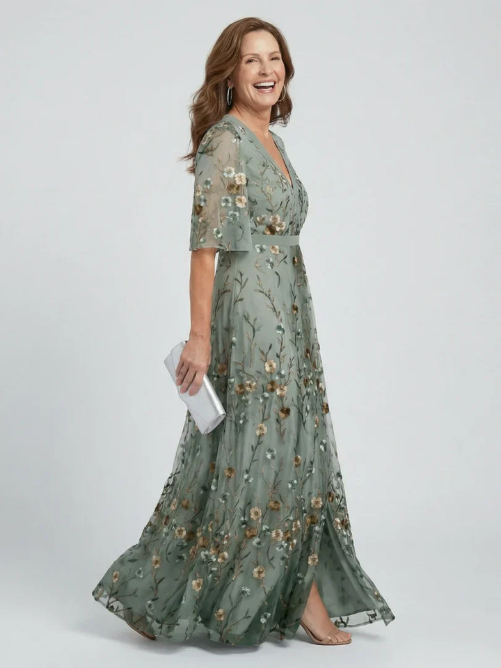 Women's stunning embroidered maxi dress with floral patterns, a perfect wedding guest option.