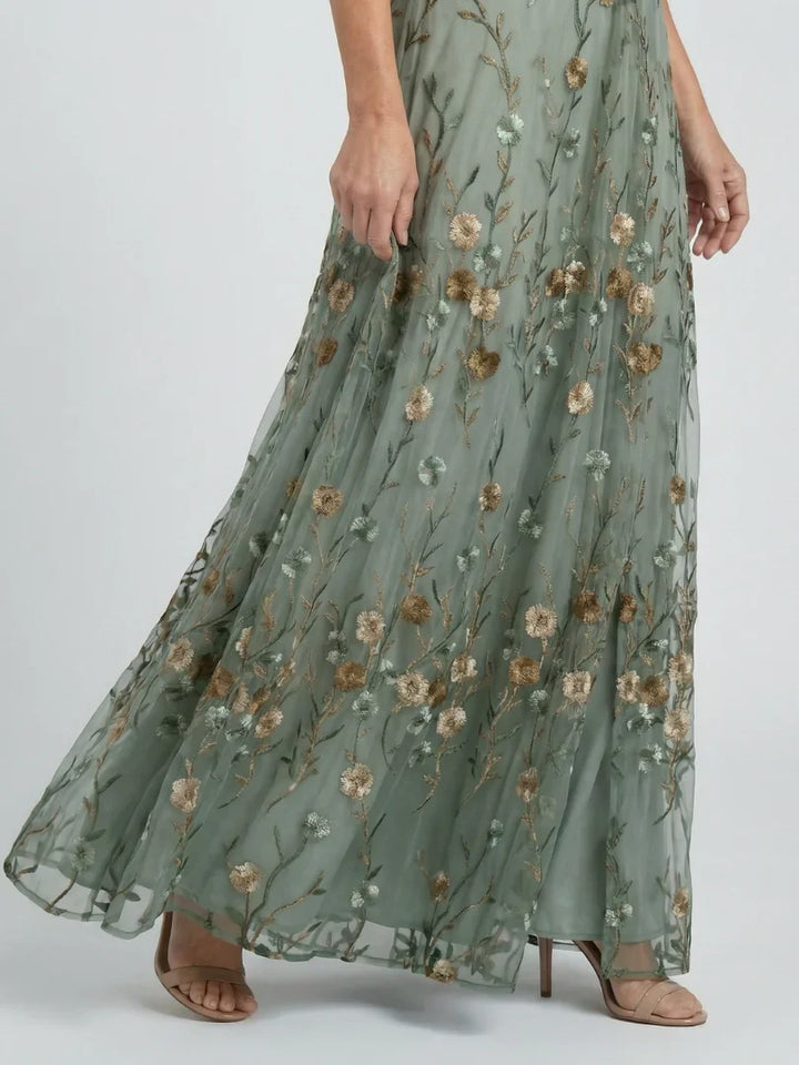 Lightweight summer maxi dress showcasing vibrant floral embroidery for your holiday wardrobe.