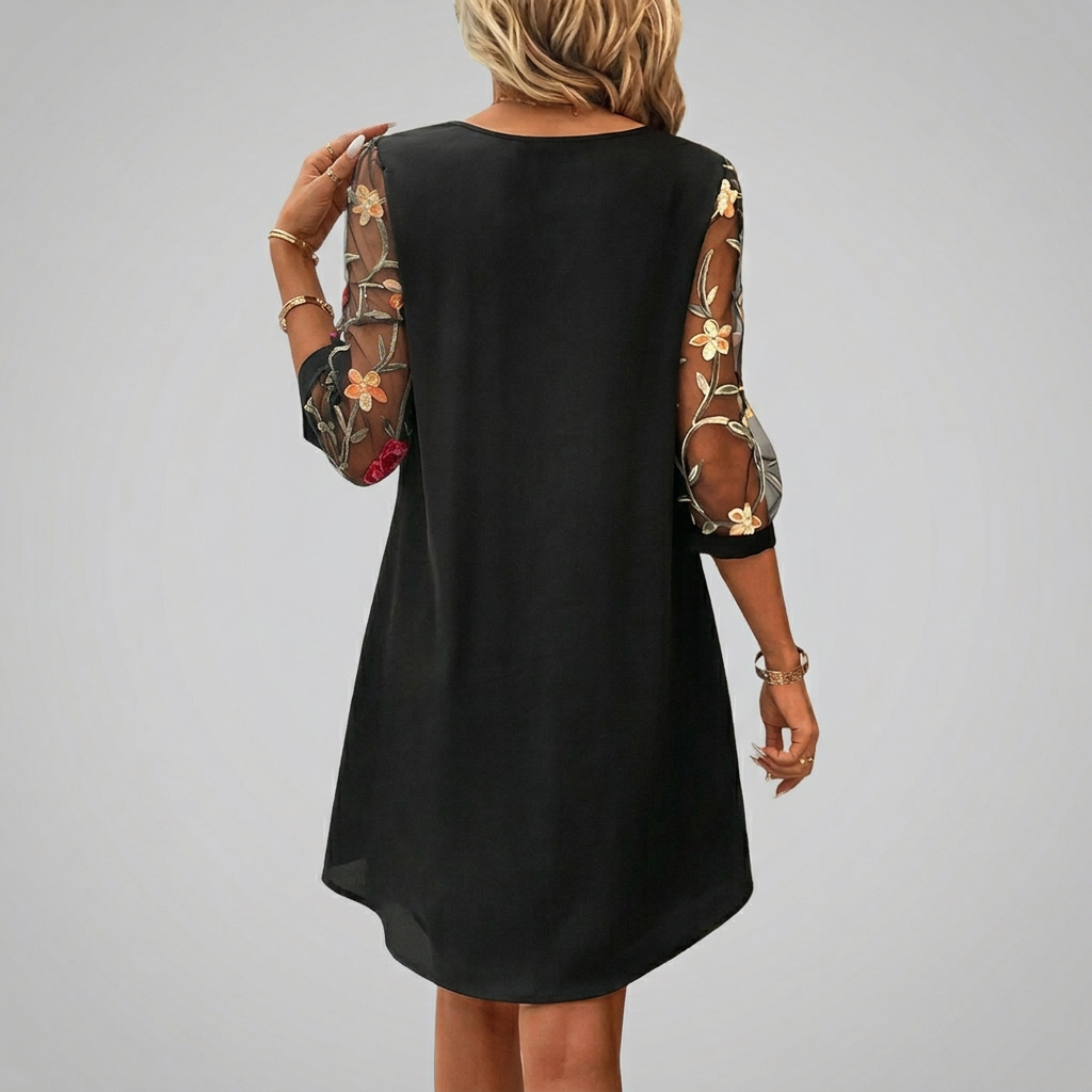 Women's casual floral mini dress, featuring delicate embroidery, a keyhole neckline, and three-quarter sleeves for daywear.