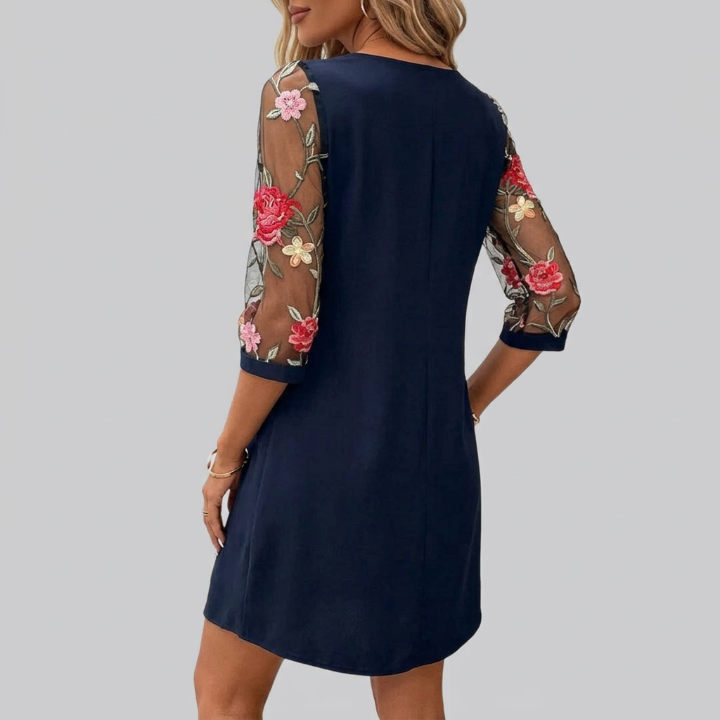 Stylish women's embroidered floral mini dress with three-quarter sleeves and keyhole neckline; an elegant summer day dress.