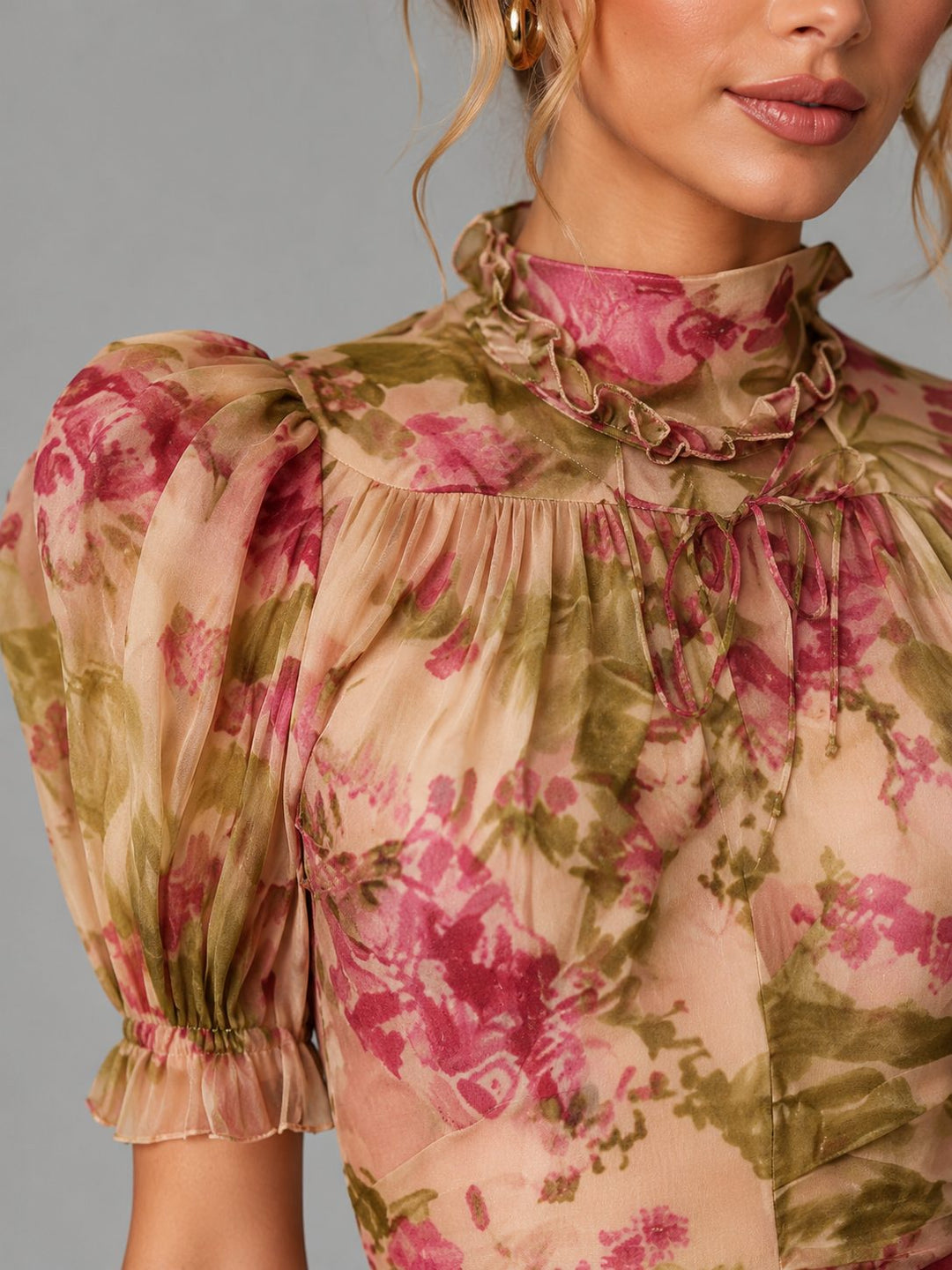 Stylish women's maxi dress featuring a floral pattern, puff sleeves, and a flattering fishtail silhouette.