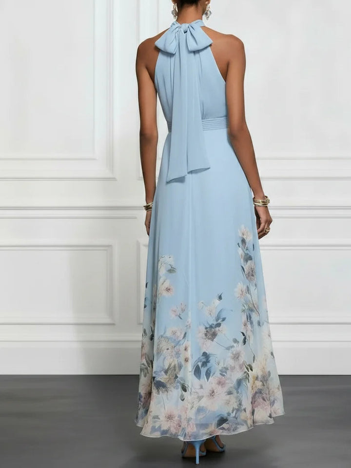 Vibrant floral A-line maxi dress for women, featuring a stylish halter neck. Ideal for summer parties & events.