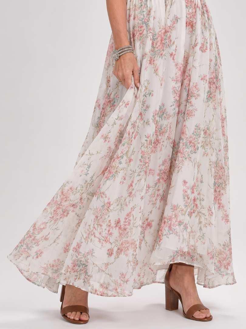 Comfortable women's summer midi dress featuring a vibrant floral pattern and a flattering halter design. Vacation ready.