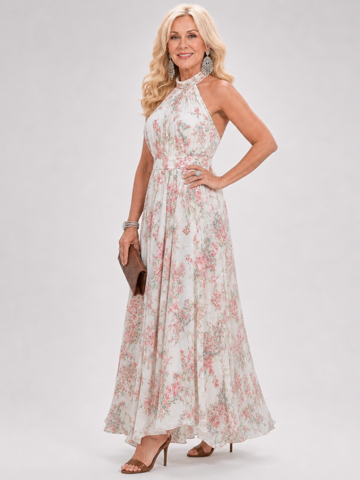 Flowing elegant floral halter midi dress for women. Sleeveless design offers effortless style for special occasions.