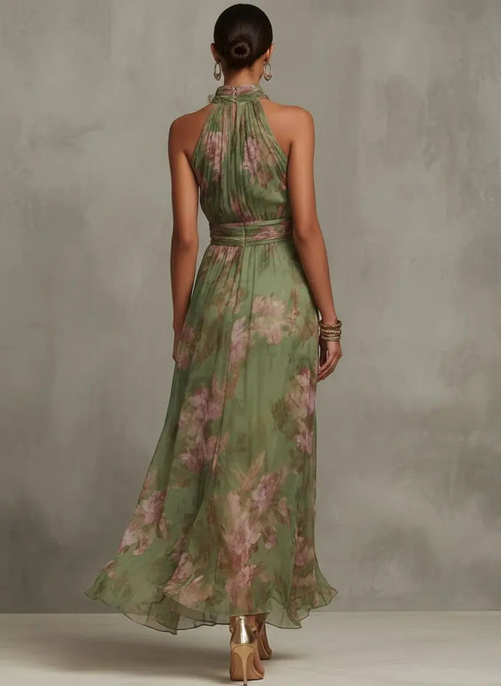 Flowy pink and green floral halterneck midi dress for women, ideal for spring fashion.
